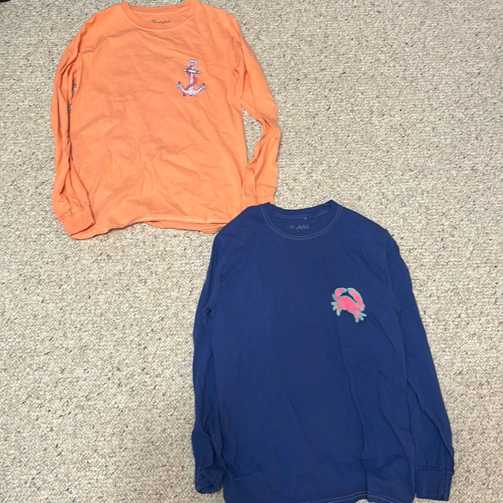 two long sleeve shirts